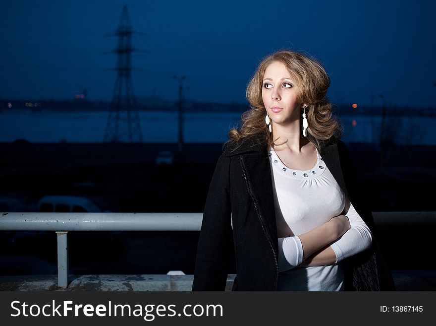 Evening walk on the balcony overlooking the lake at night. Evening walk on the balcony overlooking the lake at night