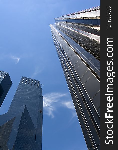 Two High-rise buildings under blue sky in New York city. Two High-rise buildings under blue sky in New York city.