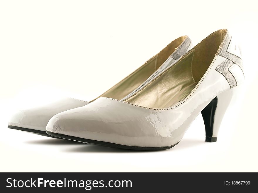 White female shoes on a white background