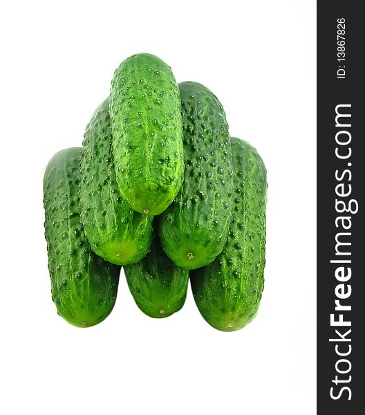 Fresh cucumbers in a pile isolated on the white