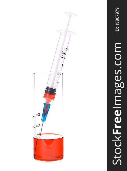 Tubes and syringe with red liquid on a white background. Tubes and syringe with red liquid on a white background