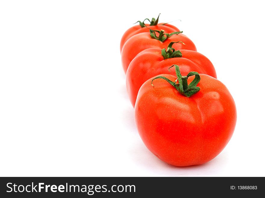 Four tomatoes isolated on the white background