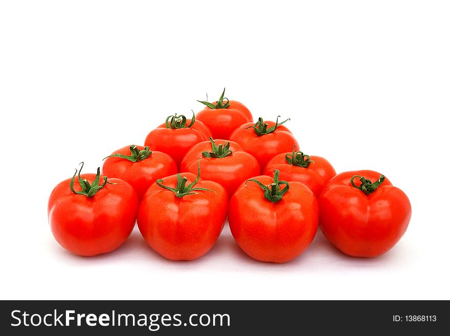A few red tomatoes isolated on white. A few red tomatoes isolated on white