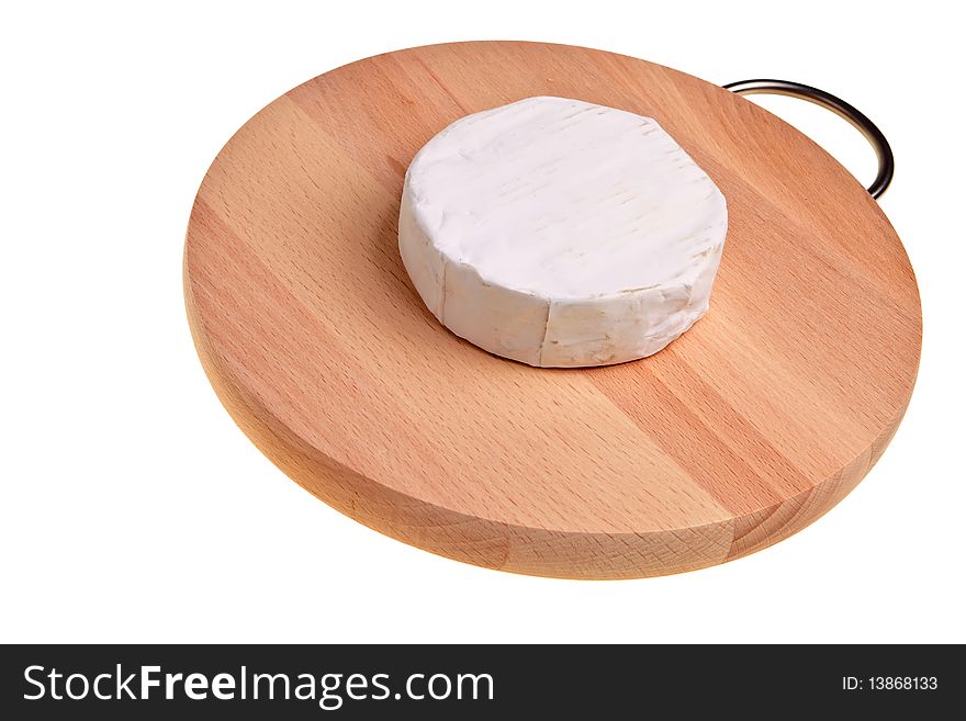 Round cheese block on wooden board over white background. Round cheese block on wooden board over white background.