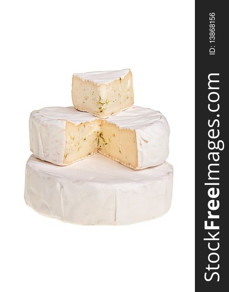 Stacked round cheese blocks with cut out segment over white background. Stacked round cheese blocks with cut out segment over white background.