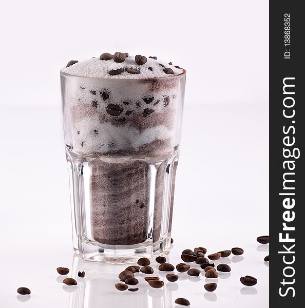 Studio shot of a glass of latte macchiato on white background. Studio shot of a glass of latte macchiato on white background