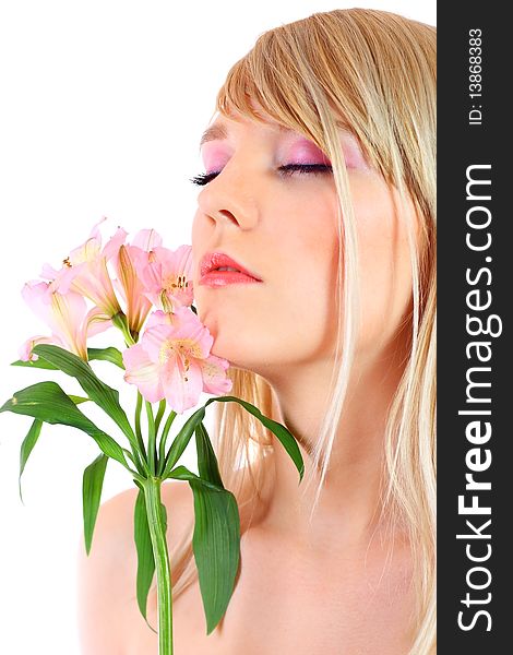 Portrait of a woman holding pink flowers over white background