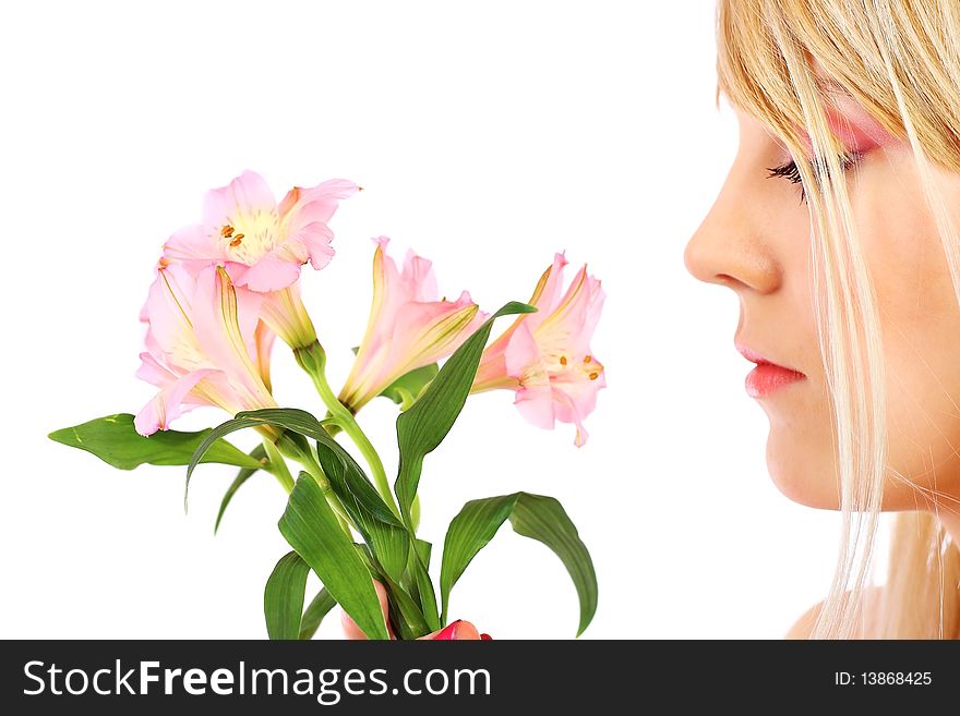 Portrait of a woman holding pink flowers over white background