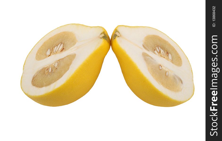 Two halves of fruit pomelo lie nearby isolated in white