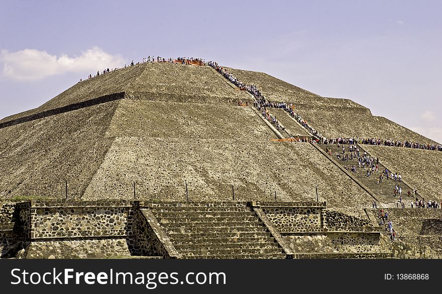 Pilgrims climbing the Pyramid of the Sun in Teotihuacan, Mexico