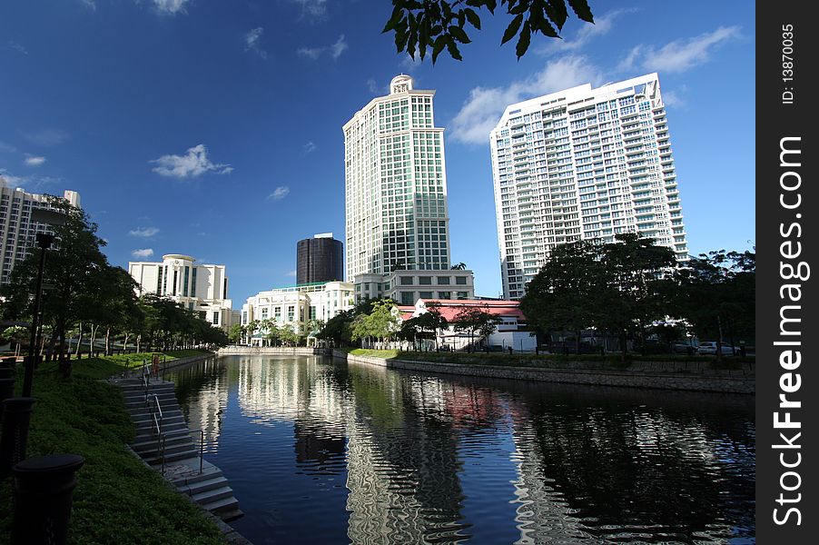 High tower on road with blue sky and shadow in the water. High tower on road with blue sky and shadow in the water