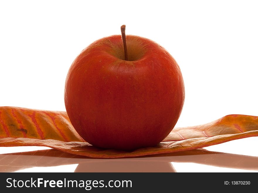 Red apple with reflection on isolated white background