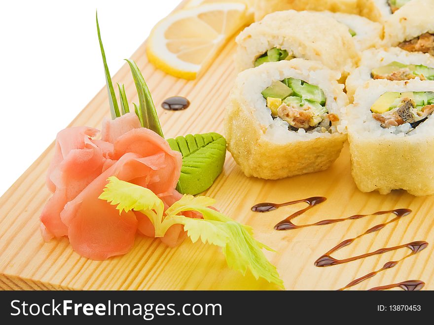 Decoration and flavouring for sushi on wooden plate