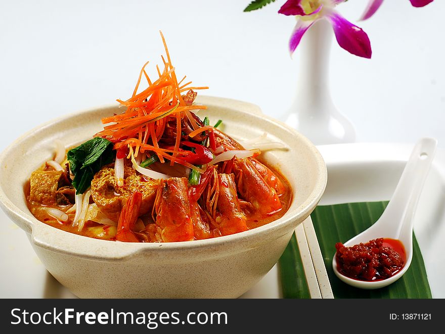 A prawn curry noodles image on the white background