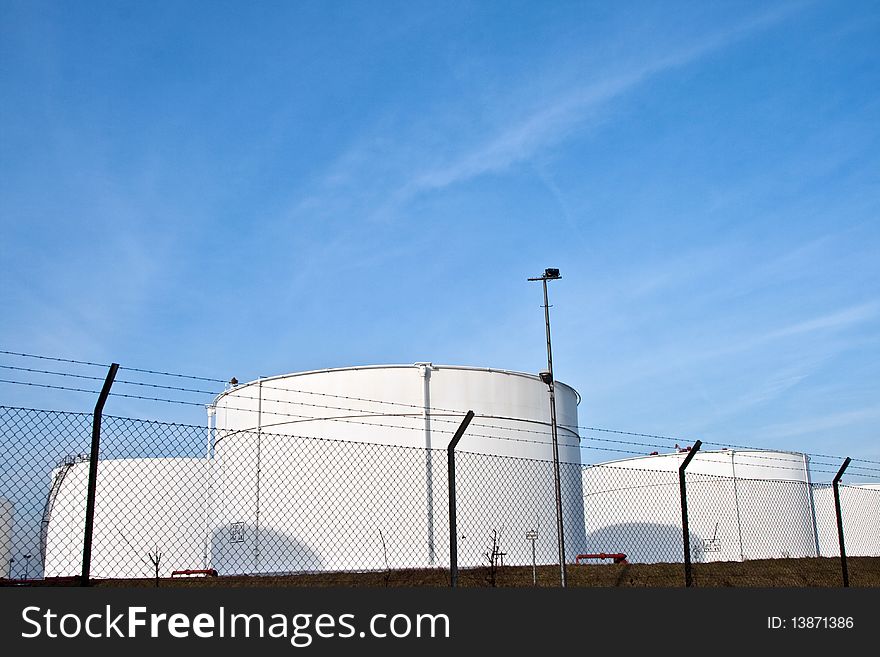 White Tanks In Tank Farm With Blue Clear Sky