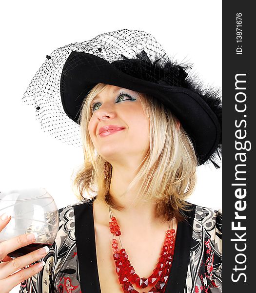 Beautiful blond woman in fashion dress and old stile hat with glass of wine isolated on the white. Studio shoot for actress in retro stile. Beautiful blond woman in fashion dress and old stile hat with glass of wine isolated on the white. Studio shoot for actress in retro stile.