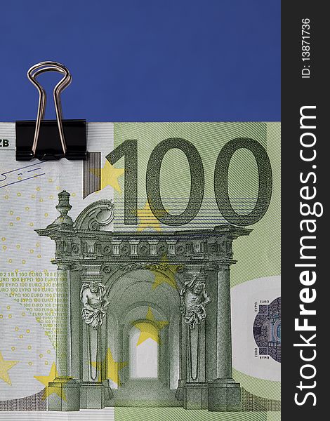 Euro banknote with binder clip, close-up