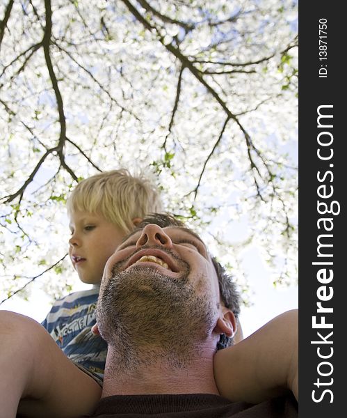 Father carries his son on shoulder. *** Local Caption *** Germany, Europe