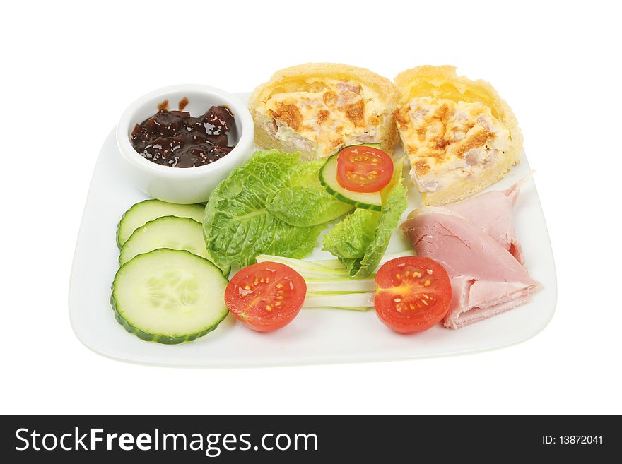 Ham and quiche salad on a plate isolated on white