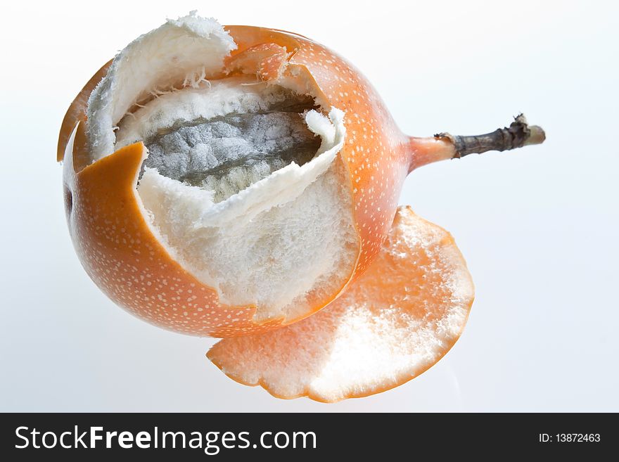 A partially opened granadilla, or Grenadia, against a white background