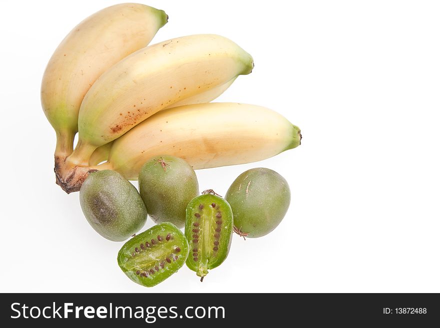 A bunch of apple, or finger, bananas and baby kiwi fruits against a white background. A bunch of apple, or finger, bananas and baby kiwi fruits against a white background