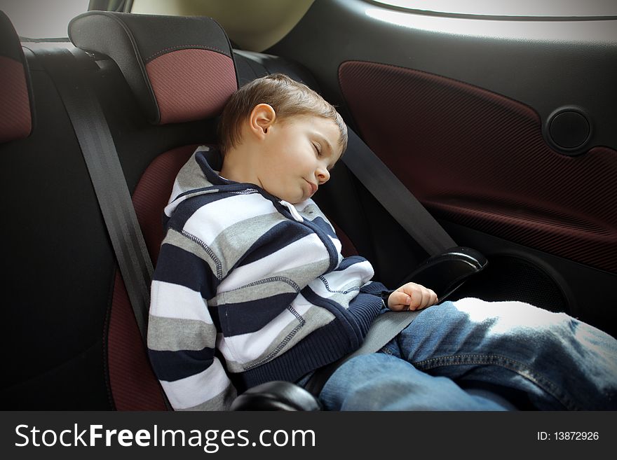 Child sleeping in a car