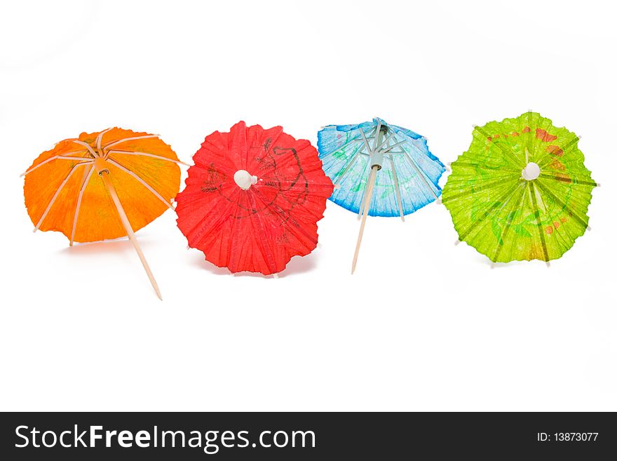 Cocktail umbrellas on a white background