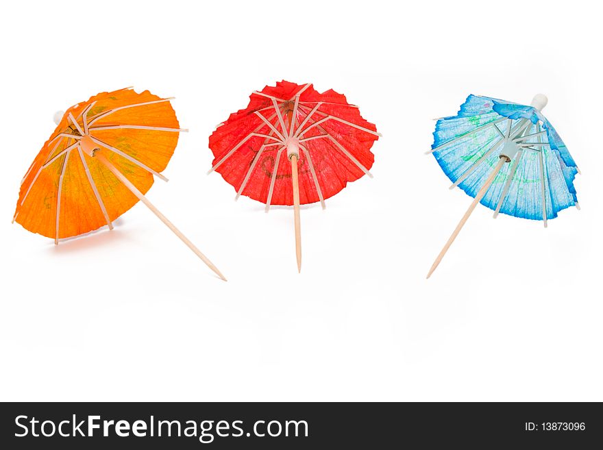 Cocktail umbrellas on a white background