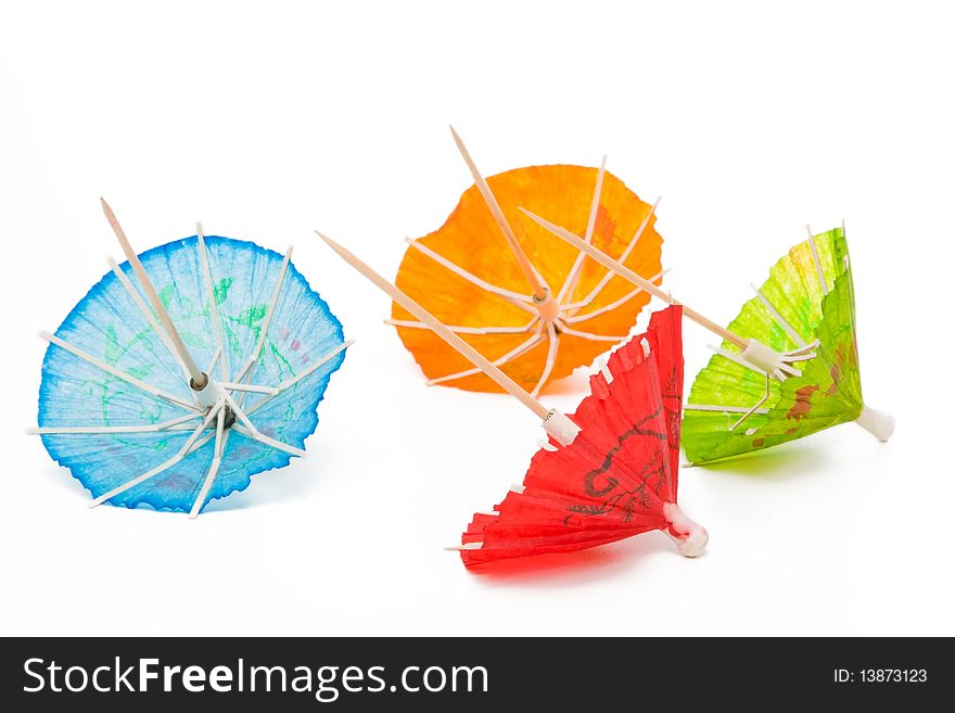 Cocktail umbrellas on a white background