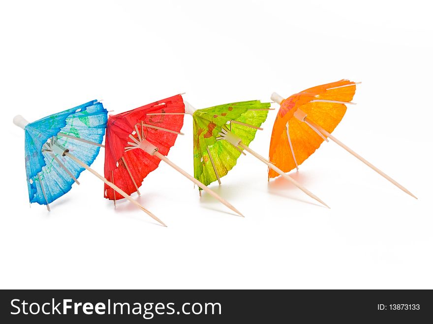 Cocktail umbrellas on a white background