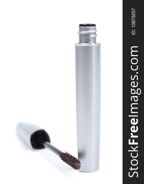 Silver mascara isolated over white