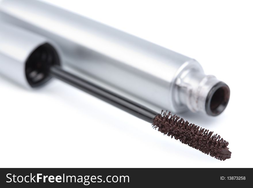 Silver mascara isolated over white