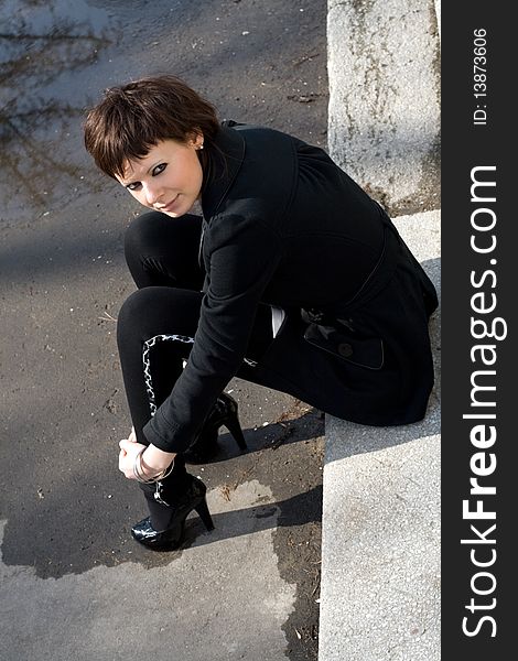 Girl sitting on stairs outdoor