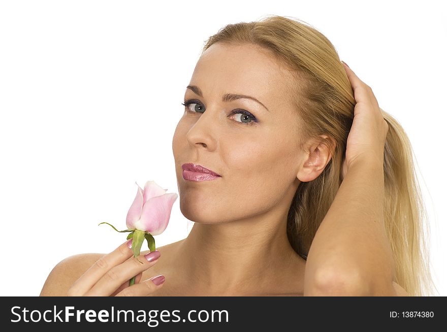 A beautiful woman with a rose looking at the camera. A beautiful woman with a rose looking at the camera