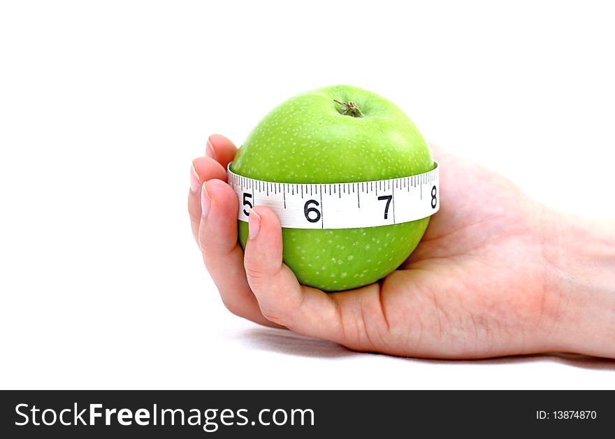 Apple on a palm, white background