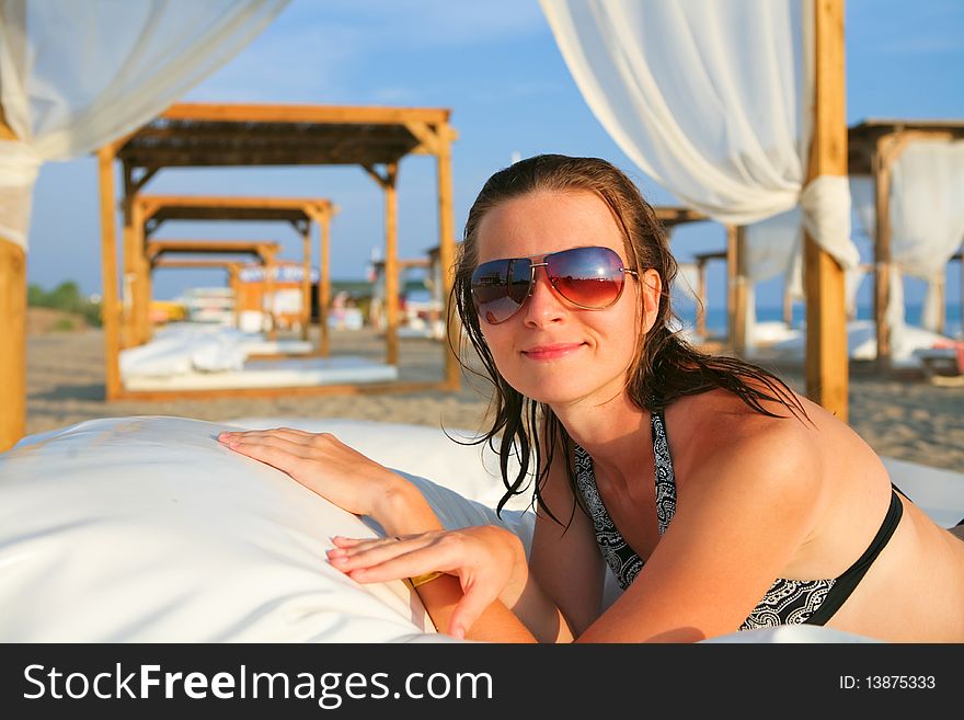 Attractive model resting on the tropical beach. Attractive model resting on the tropical beach