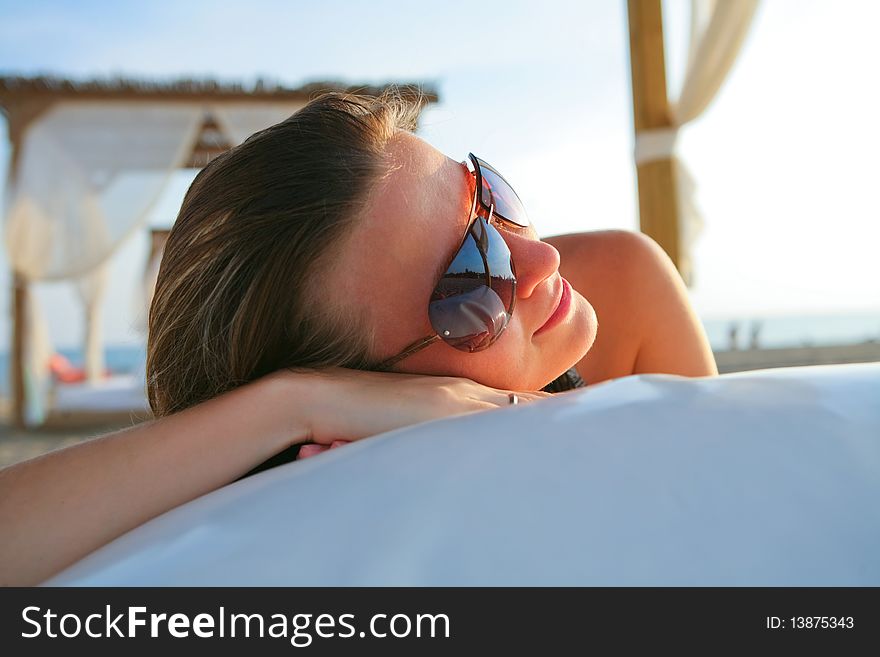 Attractive Model Resting On The Beach