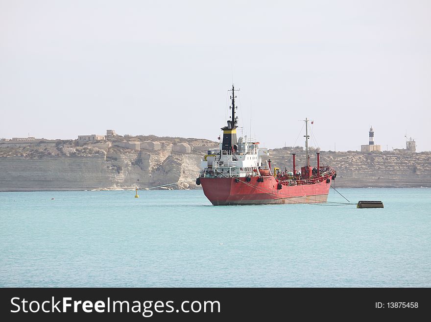 A red nautical vessel in the mediterranean