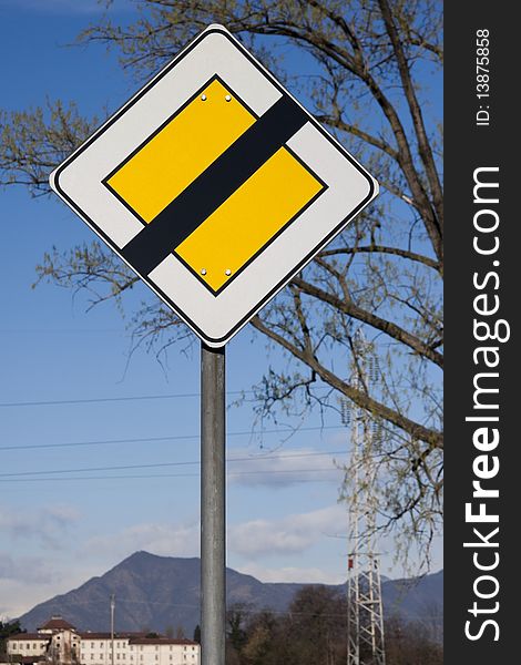Road sign on mountain and tree background