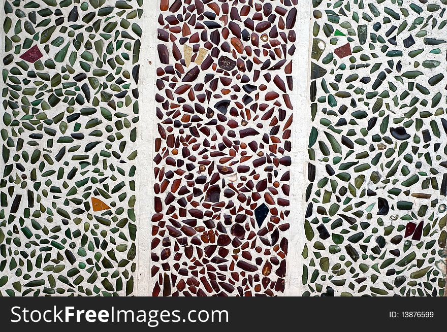 Multicolored glass panel in mortar. Multicolored glass panel in mortar