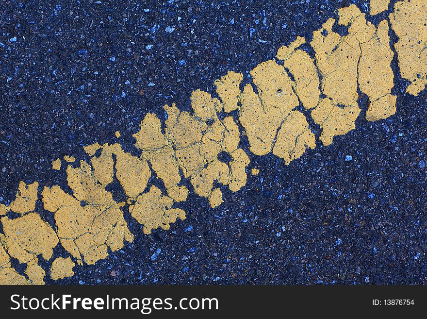 Grunge asphalt texture background with yellow line