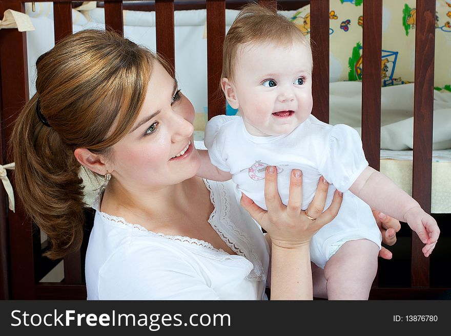 Young beautiful mother with litlle cute baby daughter. Young beautiful mother with litlle cute baby daughter