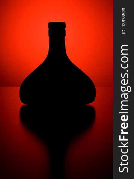 Black bottle with red background