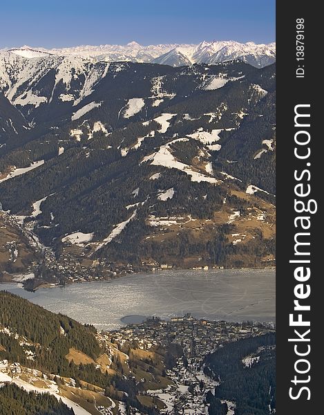 Zell am see ski resort in austrian alps by lake in winter view from mountain top