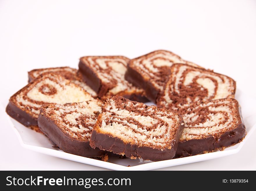 Chocolate cake served on a white plate