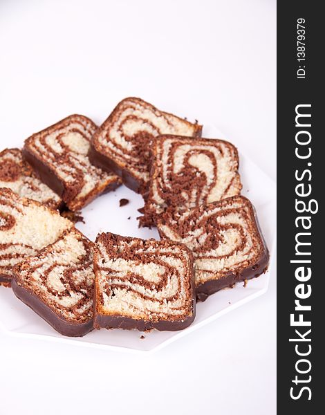 Chocolate cake served on a white plate