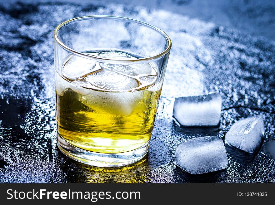 Glass Of Whiskey On Dark Background