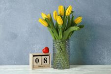 Beautiful Yellow Tulips In A Glass Vase On White Background Royalty Free Stock Photography