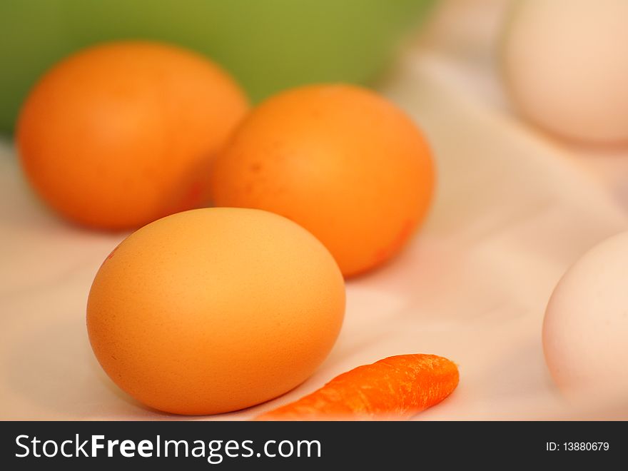 On the table are a few raw eggs. On the table are a few raw eggs.