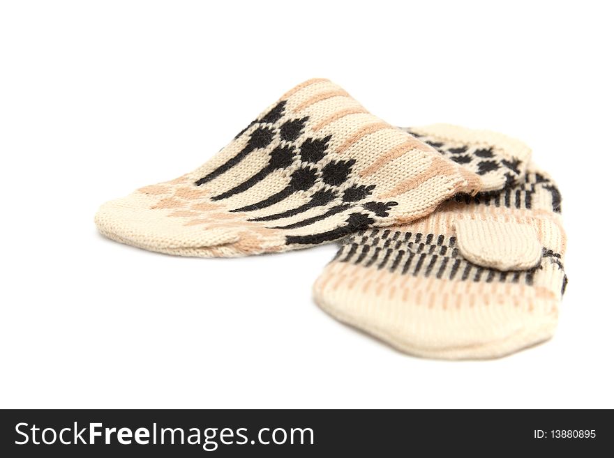 Beige mittens with patterns on a white background